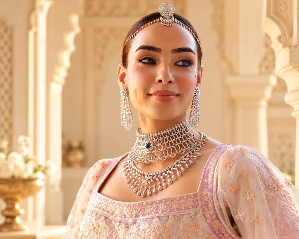 Model wearing a JKJ diamond choker and long necklace with diamond earrings